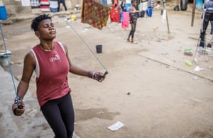 Abosede Obisanya skips with a rope while people are just visible in the background