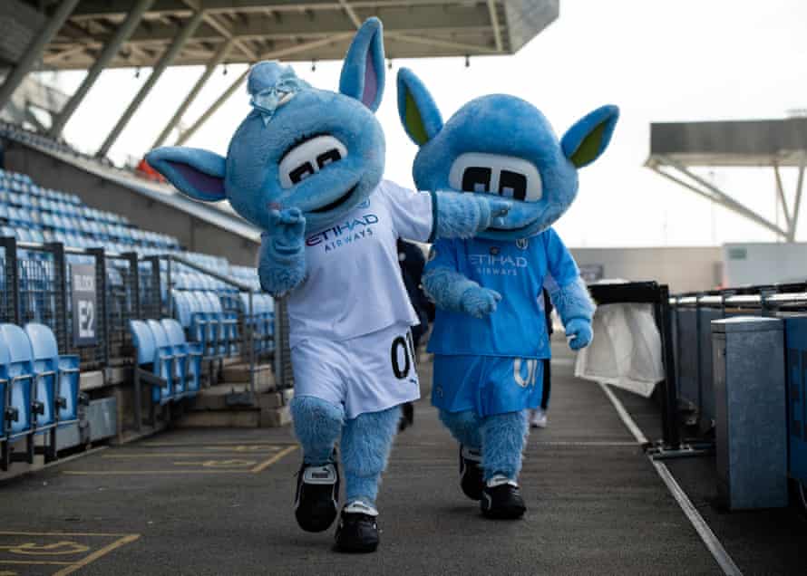 Manchester City mascots Moonbeam (front) and Moonchester.