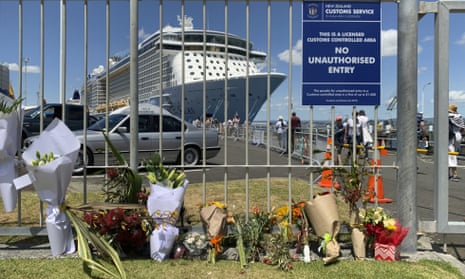 Flowers are laid on makeshift memorial is seen in front of cruise ship Ovation of the Seas, in Tauranga, New Zealand.