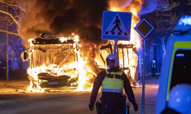 A city bus burns on a street in Malmo, Sweden, on Saturday.