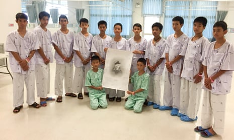The Wild Boars football team and their coach at the Chiang Rai Prachanukroh hospital