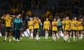 The Matildas walk off the pitch after losing to England in the World Cup semi-final at Stadium Australia.