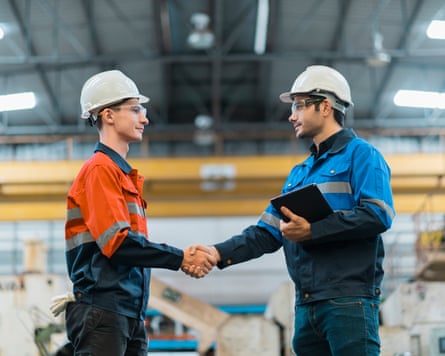 Hand shake greeting of professional engineer teamwork in factory