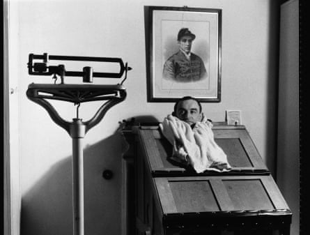 Famous British jockey Harry Carr takes a steam bath in the 1950s.