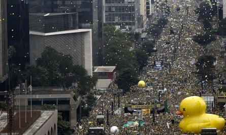 Demonstrators take part in a protest to demand the resignation of Brazilian president Dilma Rousseff.