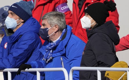 Peng (right) watches the Big Air final with Thomas Bach (centre), the president of the IOC, at the Winter Olympics last year.