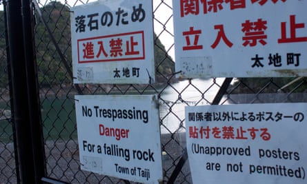 Warning signs near the cove in Taiji.