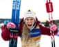 Jessie Diggins of the United States celebrates after placing first in the Tour de Ski 5km heat mass start free event on Wednesday in Toblach, Italy.