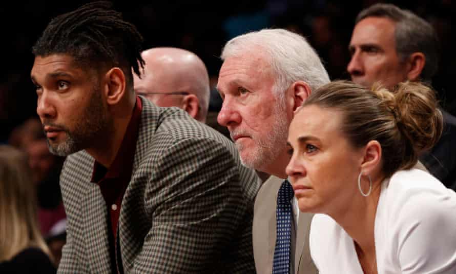 Becky Hammon (right) sits alongside fellow San Antonio Spurs assistant coach Tim Duncan (left) and head coach Gregg Popovich.