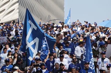 Los Angeles Dodgers fans react as the team bus passes during the victory parade.