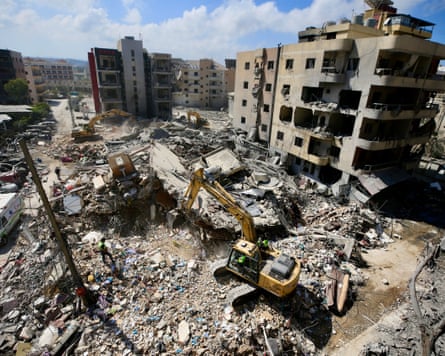 Rescuers work at the ruins of a residential building, after Israeli airstrike in Tyre, southern Lebanon.