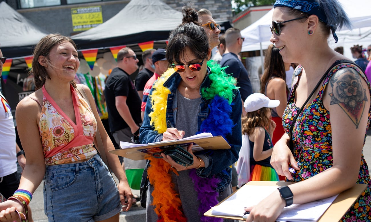 Volunteer Alex Cascio gathers signatures for a proposed abortion amendment in Ferndale, Michigan in June.