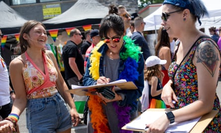 Volunteer Alex Cascio gathers signatures for a proposed abortion amendment in Ferndale, Michigan in June