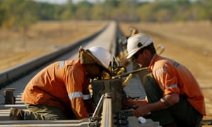 Workers prepare a joint for welding on a railway line in the Northern Territory.