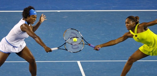 Serena Williams (left) and her sister Venus attempt to return the same ball
