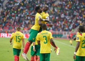 Cameroon captain Vincent Aboubakar celebrates his great goal with a blow to the chest.