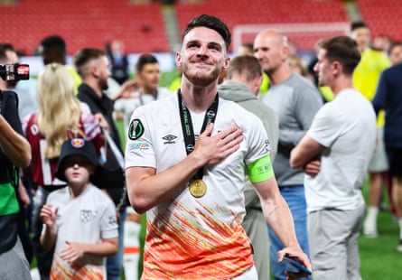 Declan Rice touches the club crest as he celebrates West Ham’s victory with the fans in Prague