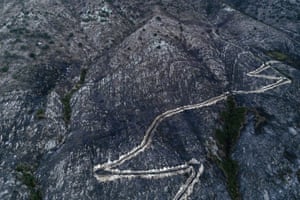 aerial image of a blackened landscape after a wildfire