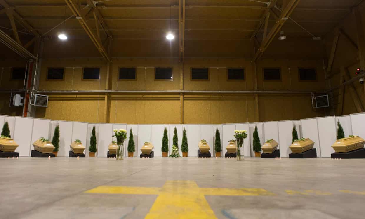 The coffins of twelve German tourists arrive back at Berlin’s Tegel airport.