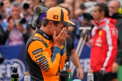 Lando Norris wipes his face after qualifying in pole for the Dutch Grand Prix.