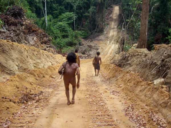 Awa villagers on a road built illegally by loggers through indigenous land in Maranhao state.