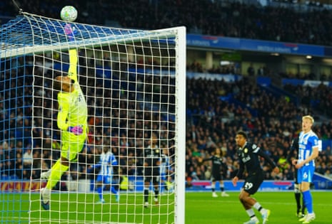Chelsea goalkeeper Robert Sánchez saves a header from Jan Paul Van Hecke of Brighton.