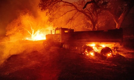 A truck burns at a property as the Glass fire burns in Calistoga, California on 1 October 2020.