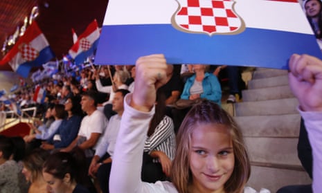 Supporters of the Croatian Democratic Union of Bosnia and Herzegovina party wave Croatian flags during a pre-election rally in Mostar, Bosnia.
