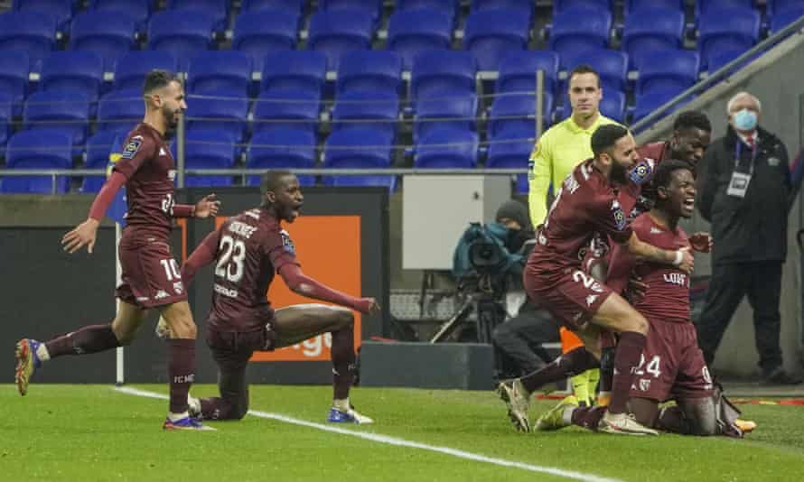 Aaron Leya Iseka celebrates after scoring the winner for Metz against Lyon.