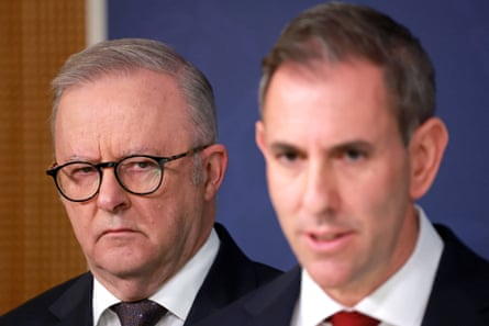 Anthony Albanese, frowning, stands next to Jim Chalmers