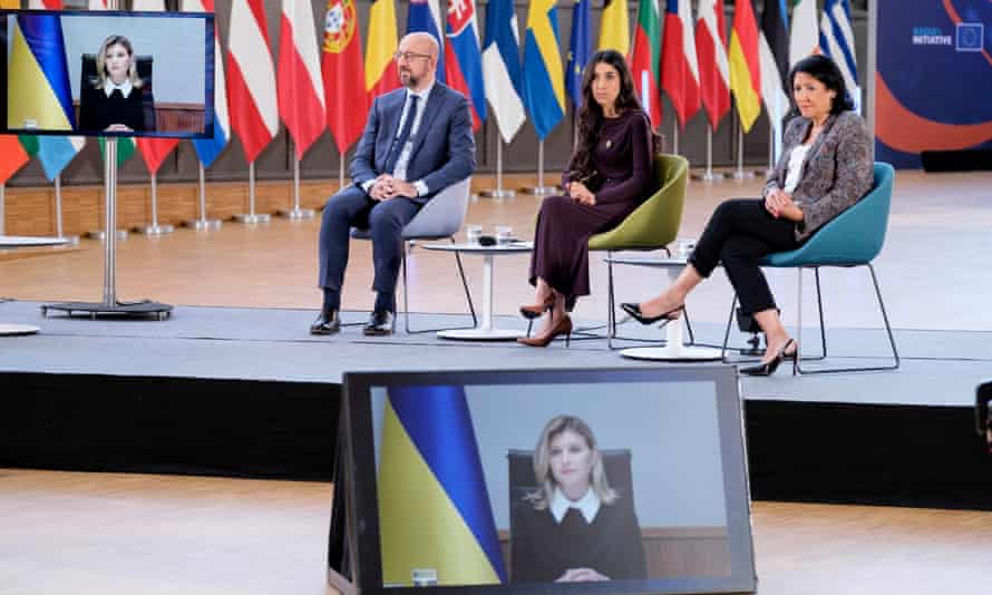 President of the European Council Charles Michel (L), human rights activist Nadia Murad Taha (C) and Georgia president Salome Zourabichvili (R) listen to Ukrainian First Lady Olena Zelenska (screen) during a conference on ‘Women in Conflicts’ that gathers women leaders and survivors of conflicts in the Europa, the EU Council headquarter on June 9, 2022 in Brussels, Belgium.