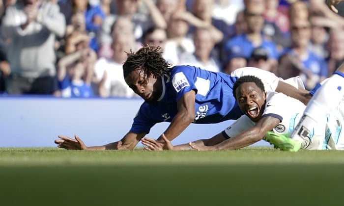 Chelsea’s Raheem Sterling reacts after hitting the deck after a challenge from Everton’s Alexander Iwobi.