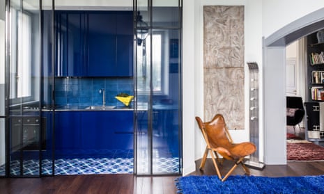 The kitchen with 1960s tiles and blue custom units.