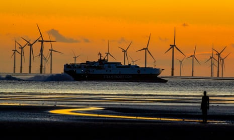 A ship passes a windfarm