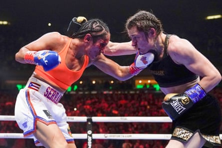 Amanda Serrano (left) and Katie Taylor trade blows during the 10th round of their fight in 2022.