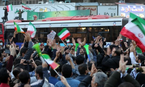 People celebrate after Iran's win against Wales
