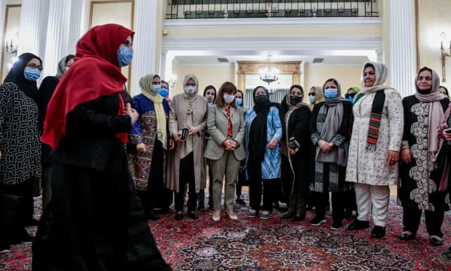 Greek President Katerina Sakellaropoulou, centre, talks with Afghan women lawyers and judges who fled from Afghanistan.