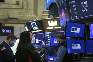Traders on the floor of the New York Stock Exchange last night