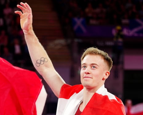 Luke Whitehouse of England celebrates winning gold in the Men's Floor Exercise final.