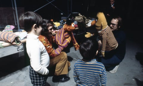 Jim Henson and Frank Oz introduce some lucky visitors to Bert and Ernie.