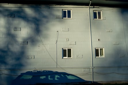 A shadow of a car on a building facade