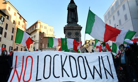 Protesters in Rome take part in a rally last week against the latest government restrictions to stem the rise in coronavirus cases.