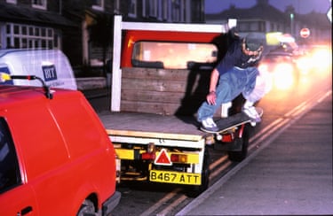 A person skateboarding on the back of a lorry’s trailer