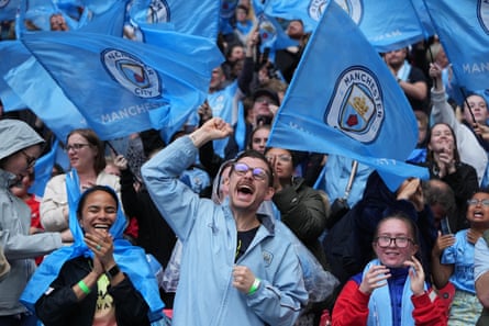 Manchester City fans celebrate when Hayley Raso scores an equaliser in the 89th minute.