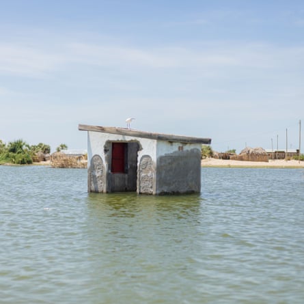 What was once a toilet is partially submerged by the rising water level of Lake Turkana