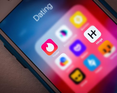 A close-up of dating apps on a phone.