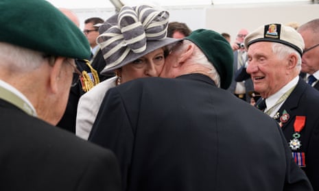 Theresa May meets D-day veterans following a service of remembrance at Bayeux cemetery in Bayeux