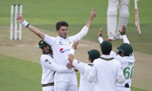 The Pakistan bowler Shaheen Afridi (second left) is congratulated by teammates after removing England’s Rory Burns for nought on day four.