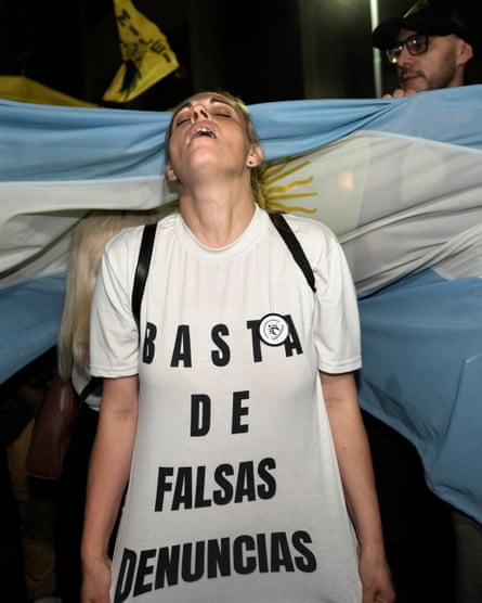 A Milei supporter wears a shirt that reads in Spanish ‘Stop the false complaints’ after polls closed in the first round on 22 October.