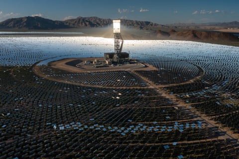 A boiler tower is surrounded by mirrors at the Ivanpah solar electric generating system in the Mojave Desert.
